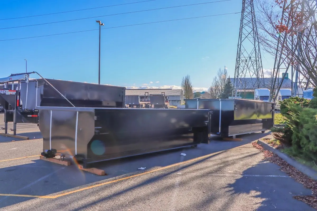 Roll-off dumpster ready for waste disposal at job site for Demolition Dumpster Rental in Waxahachie